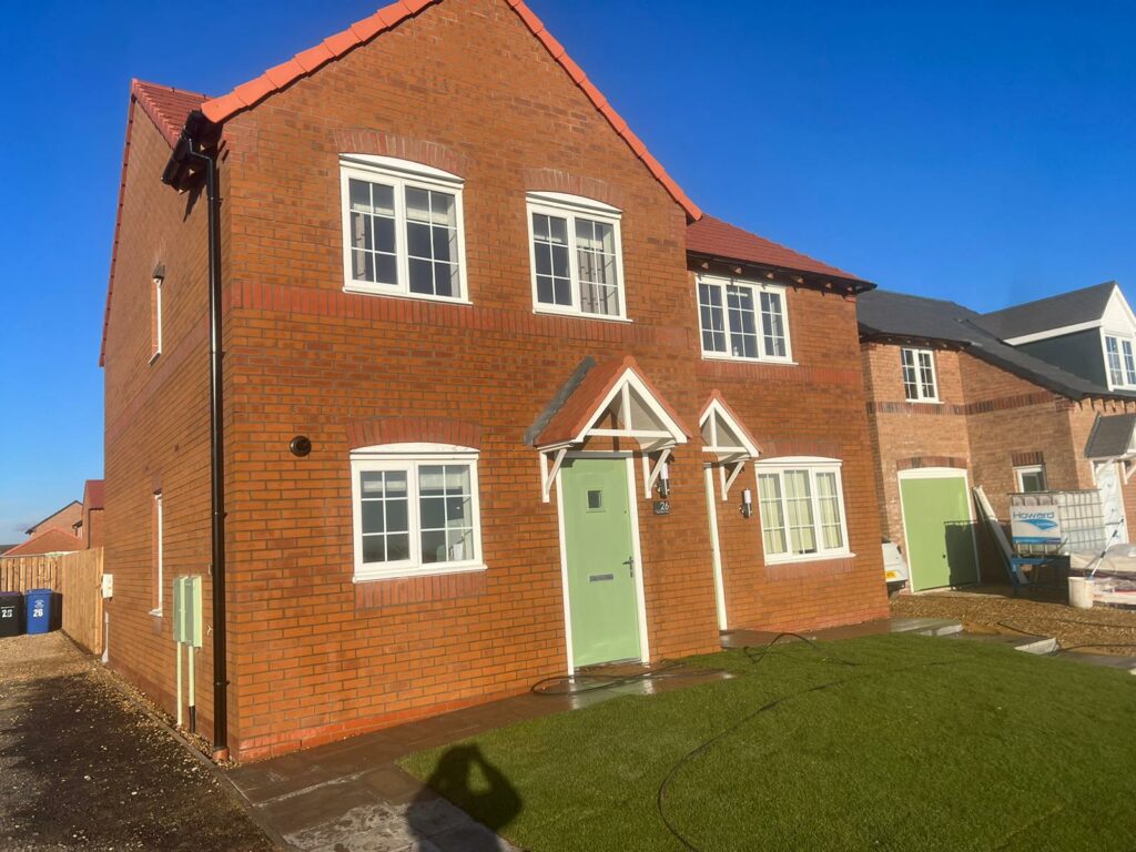 New build house after an exterior clean of the bricks, windows and door to remove excess construction debris.
